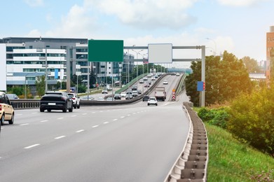 Photo of View of road, cars and buildings outdoors