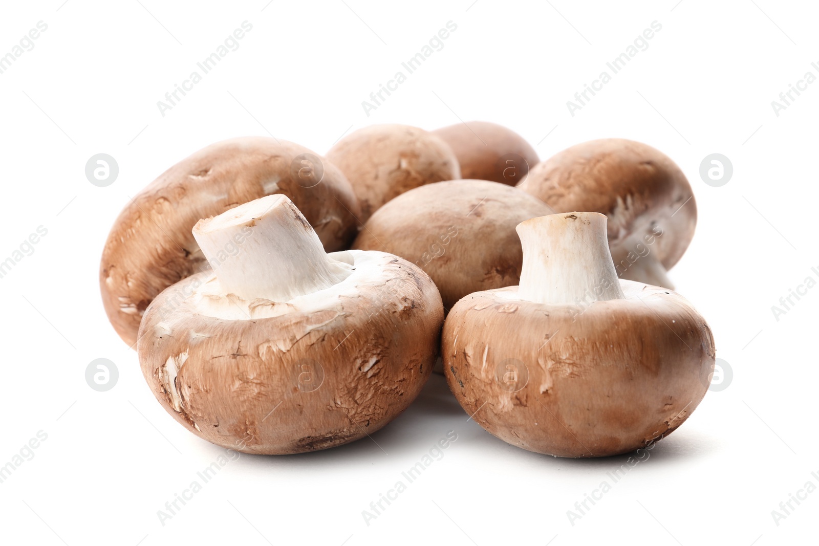 Photo of Fresh champignon mushrooms isolated on white. Healthy food