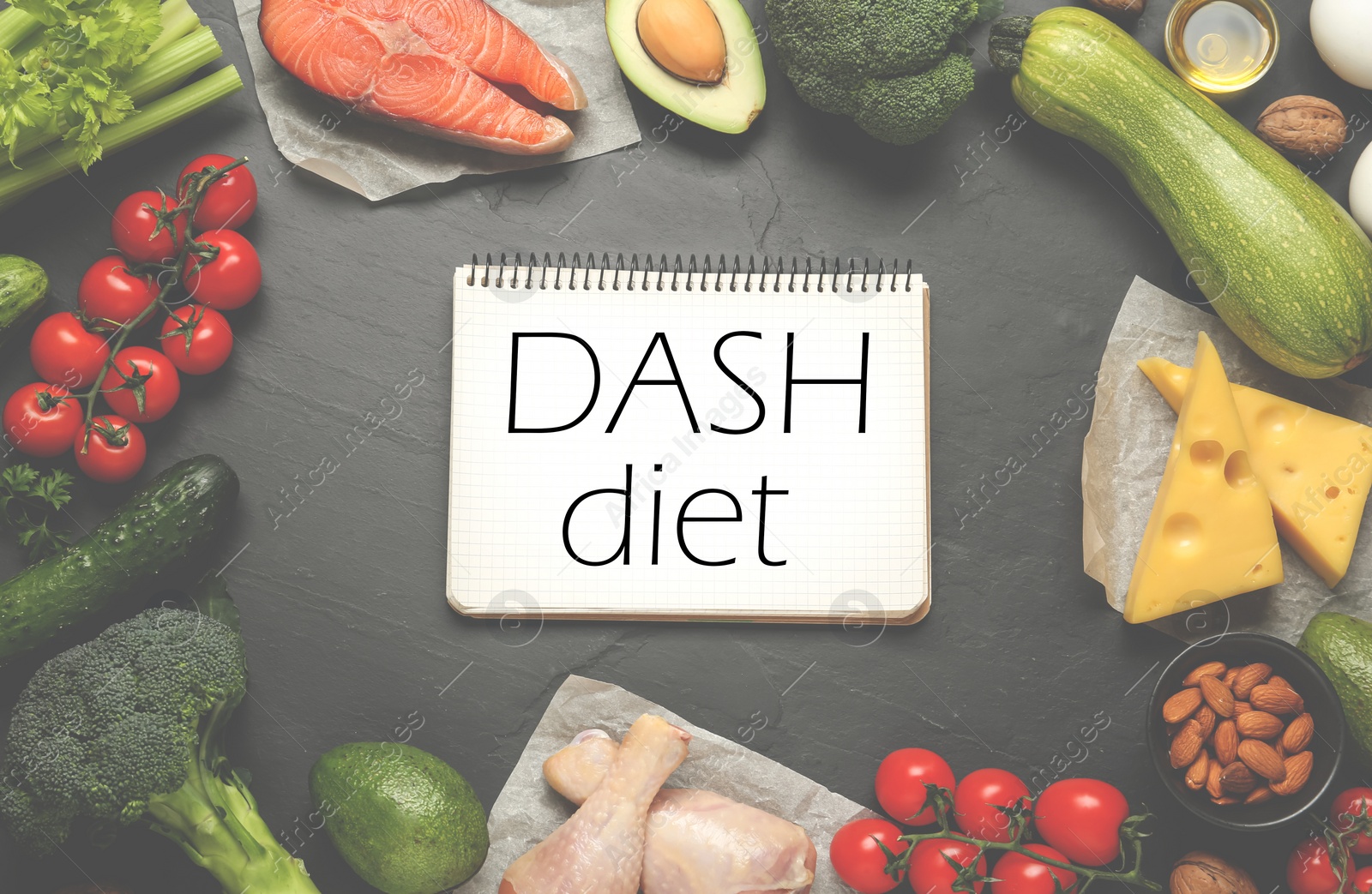 Image of Dietary approaches to stop hypertension. Many different healthy food around notebook with words Dash diet on black textured table, flat lay. Light toned design