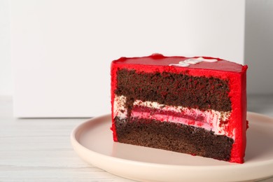 Photo of Cut bento cake on white table, closeup. Space for text