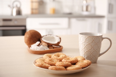 Plate with cookies on wooden table