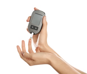 Photo of Woman checking blood sugar level with glucometer on white background. Diabetes test