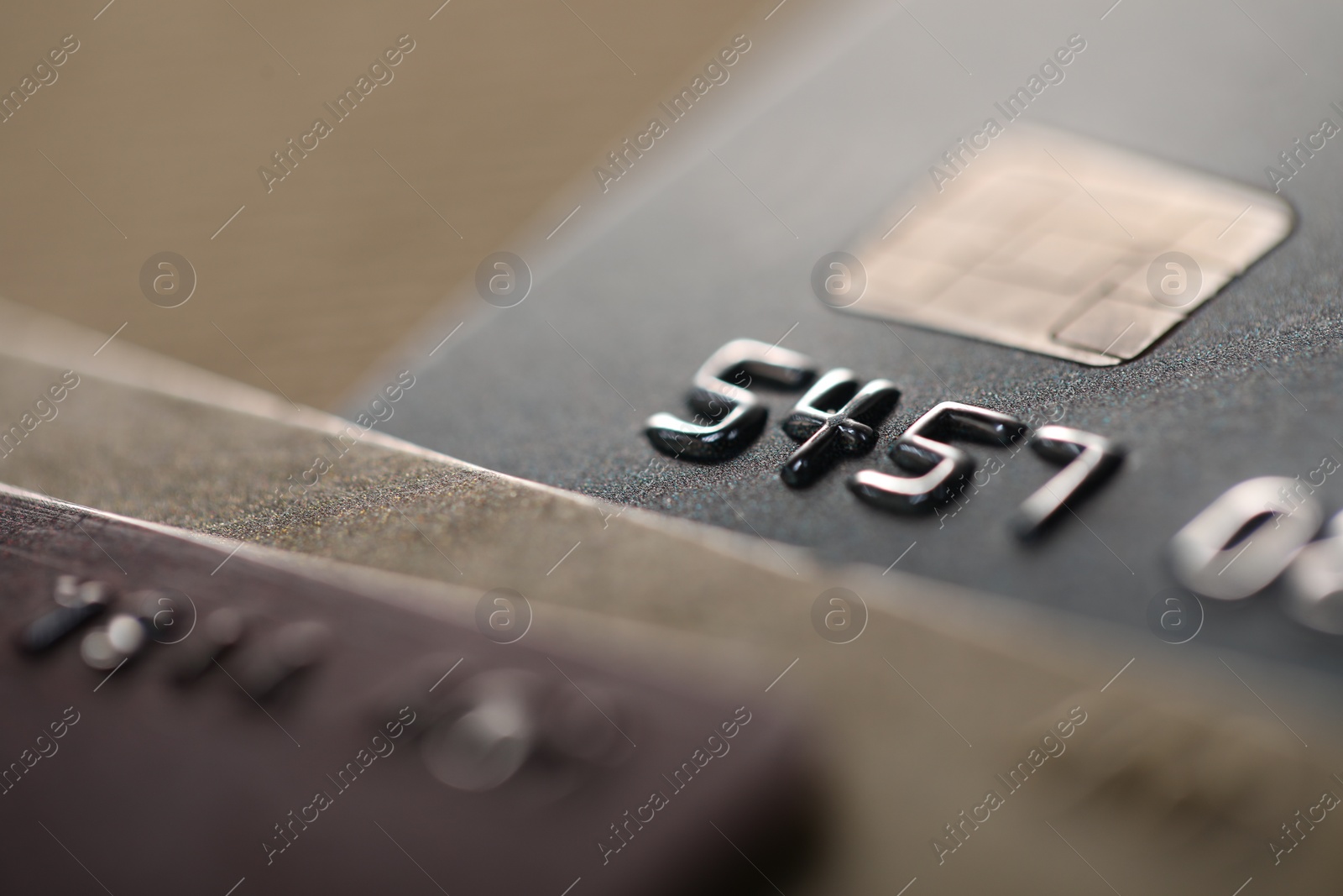 Photo of Credit cards on blurred background, macro view