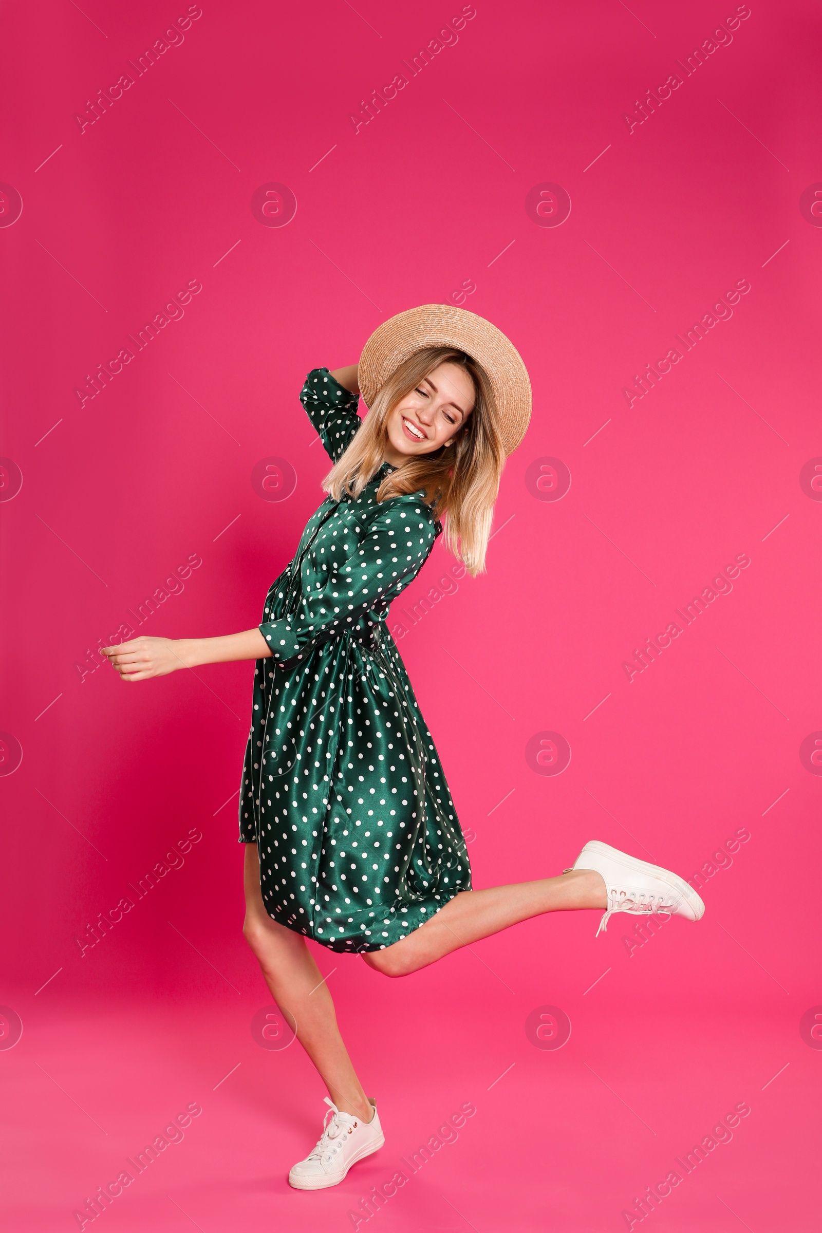 Photo of Full length portrait of emotional woman dancing on color background