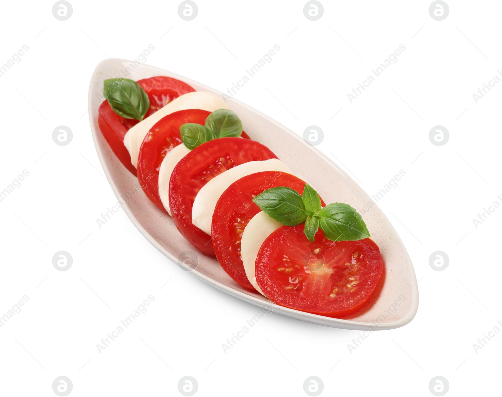 Photo of Plate of delicious Caprese salad with tomatoes, mozzarella and basil isolated on white