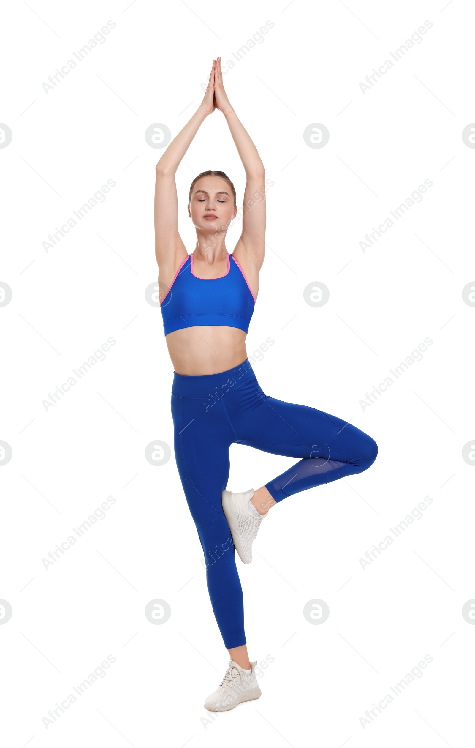 Photo of Young woman practicing yoga on white background