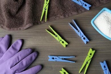 Photo of Flat lay composition with clothespins on wooden table