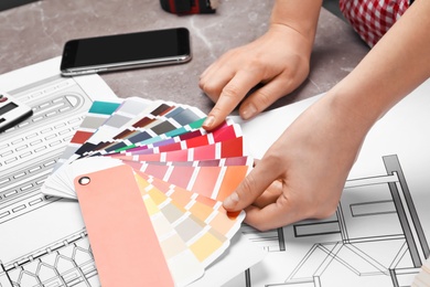 Professional decorator working at table, closeup