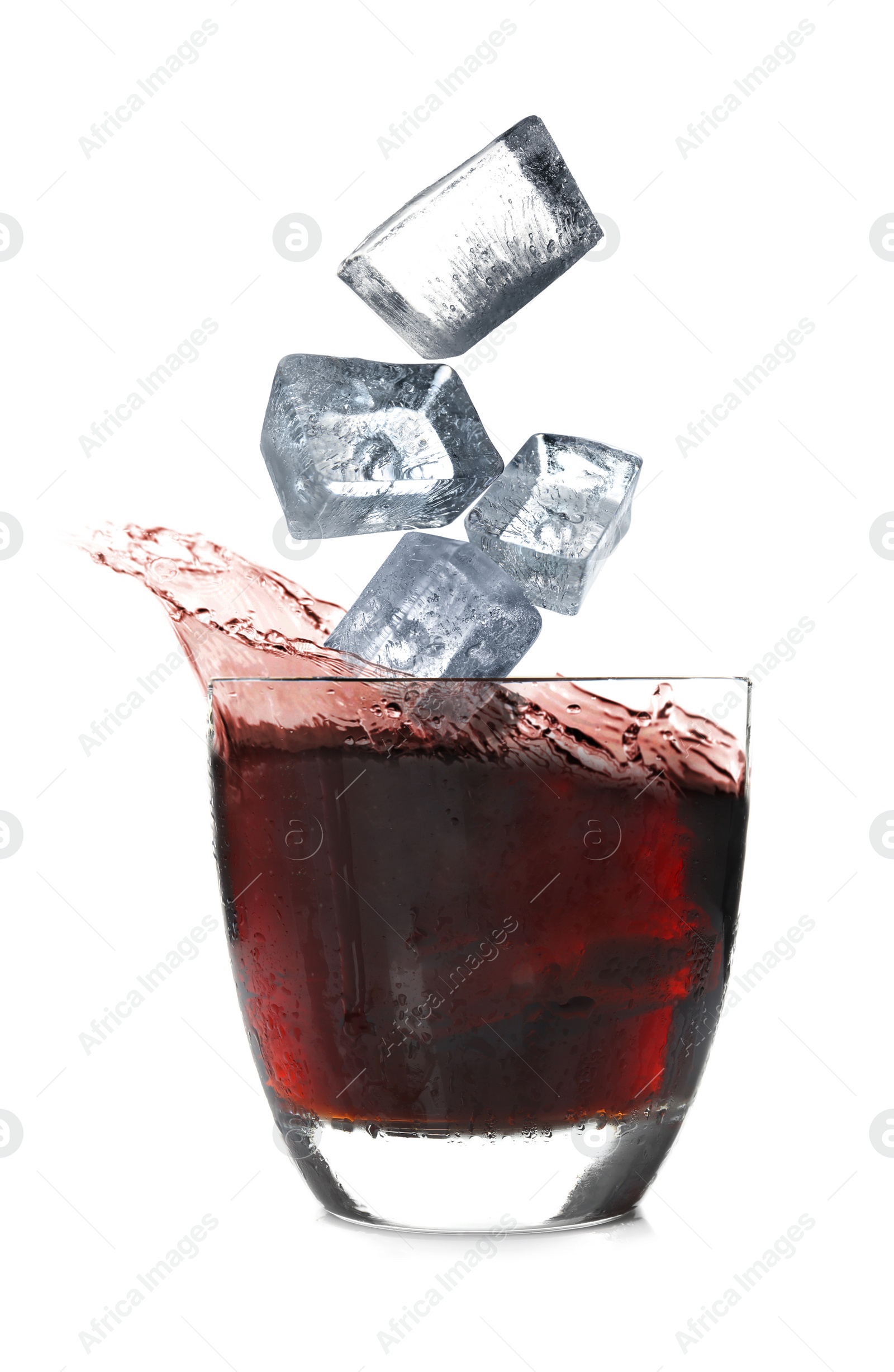 Image of Crystal ice cubes falling into refreshing drink on white background