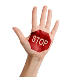 Image of Woman showing palm with drawn STOP sign on white background, closeup