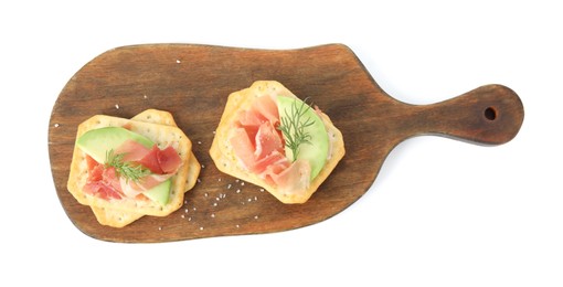 Delicious crackers with avocado, prosciutto and dill on white background, top view