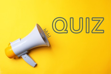 Image of Electronic megaphone and word QUIZ on yellow background, top view