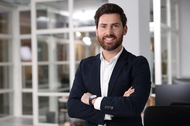 Photo of Portrait of smiling man with crossed arms in office, space for text. Lawyer, businessman, accountant or manager