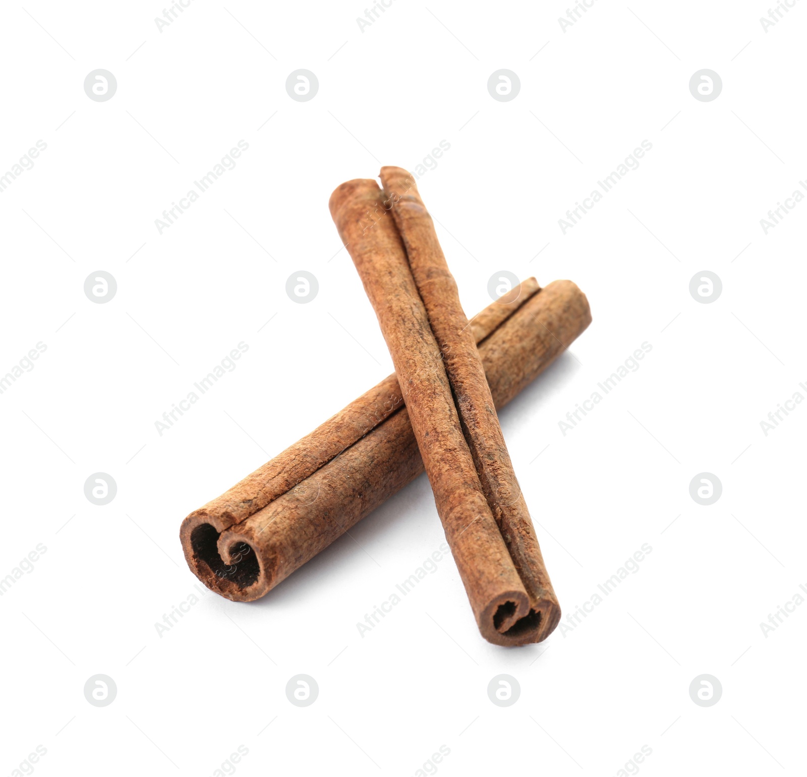 Photo of Aromatic cinnamon sticks on white background