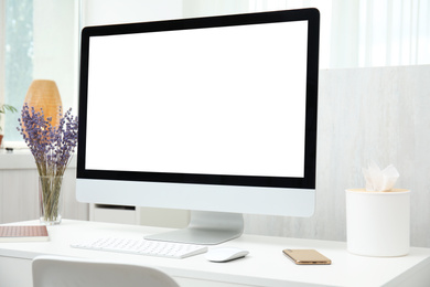 Photo of Comfortable workplace with modern computer on table