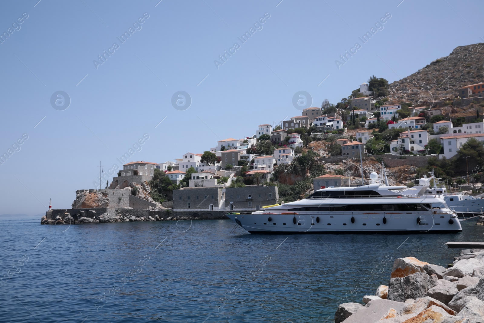 Photo of Beautiful view of sea with boat and coastal city