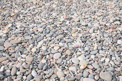 Pile of pebbles on shingle beach as background