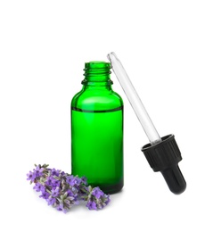 Bottle of essential oil and lavender flowers isolated on white