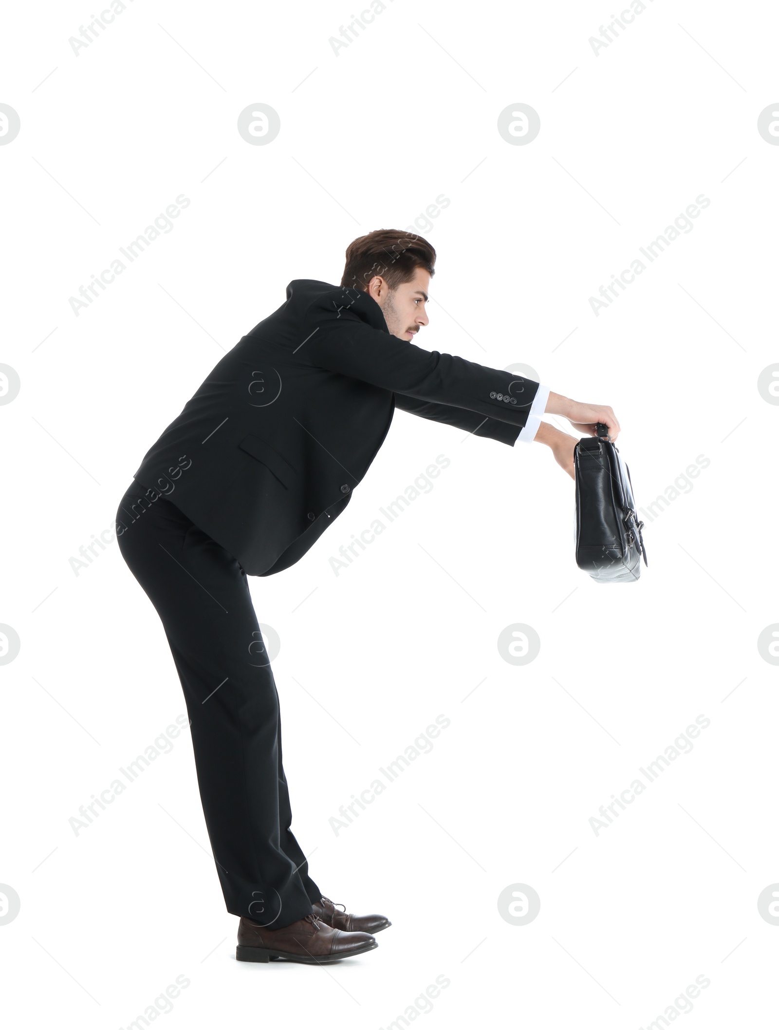 Photo of Young businessman attracted to magnet on white background