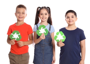 Children with recycling symbols on white background