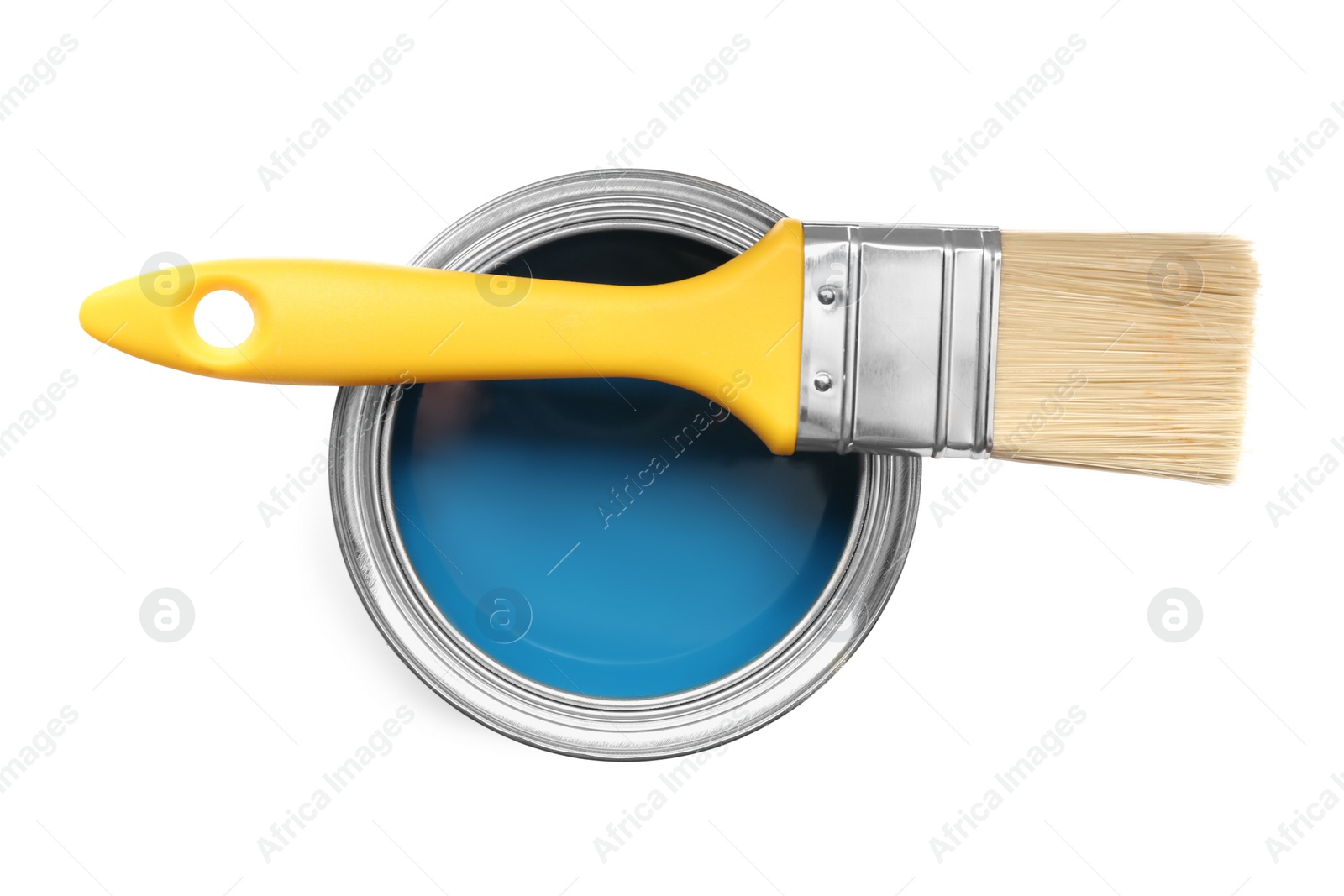 Photo of Can of blue paint and brush on white background, top view