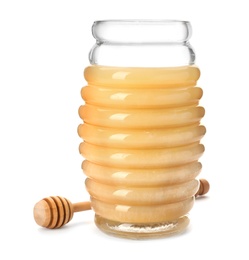 Jar with delicious honey and dipper on white background