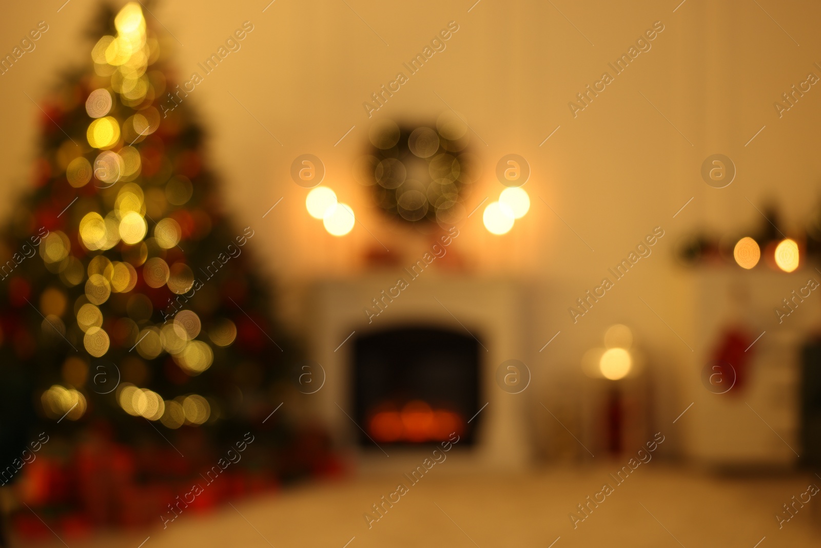 Photo of Blurred view of living room with Christmas tree near fireplace