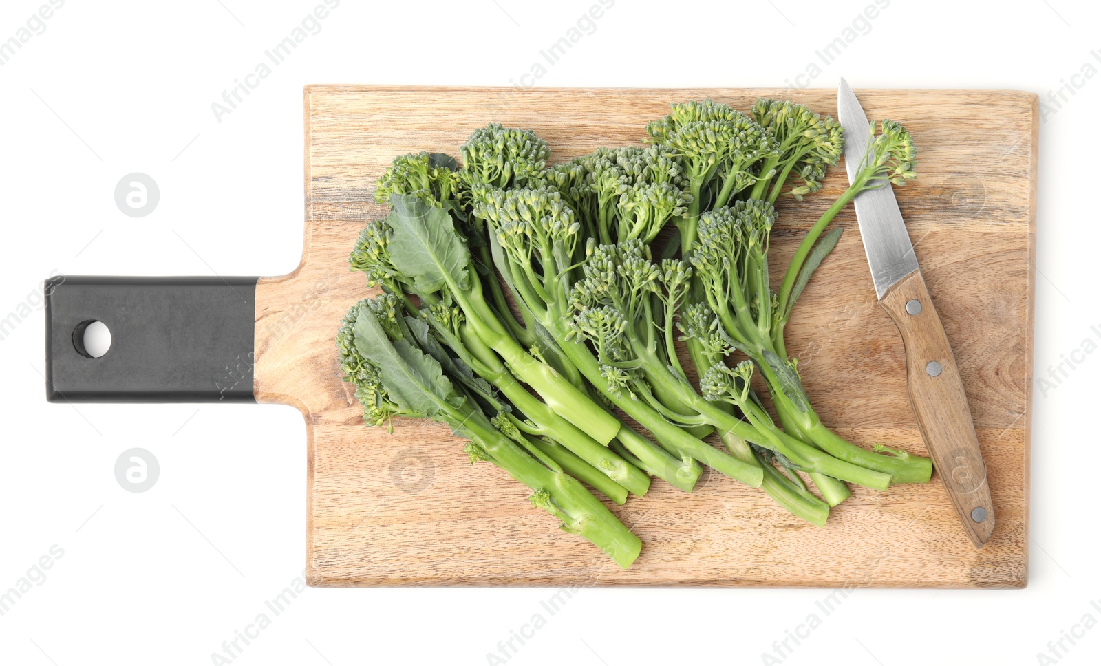 Photo of Wooden board with fresh raw broccolini and knife isolated on white, top view. Healthy food