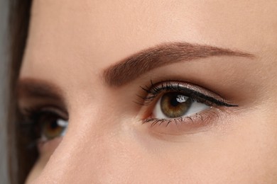 Photo of Young woman with beautiful eyes, closeup view