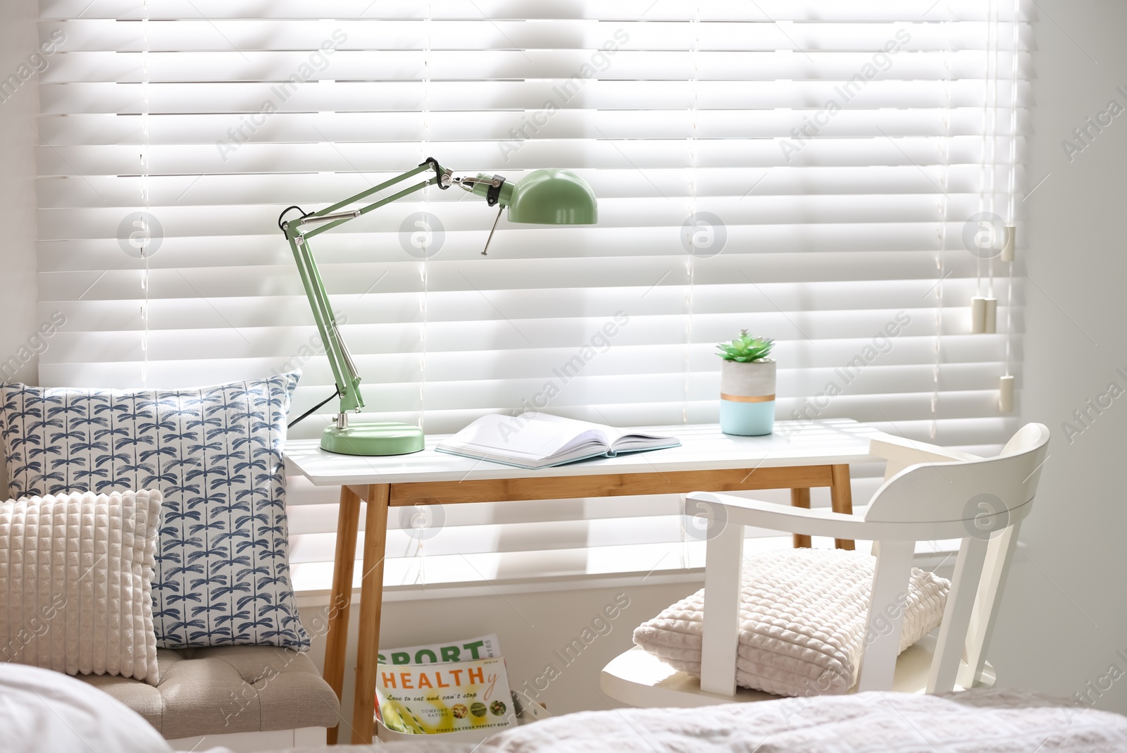 Photo of Comfortable workplace near window in modern room