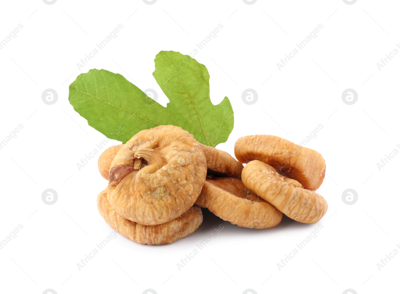 Photo of Tasty dried figs and green leaf isolated on white