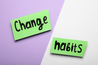 Photo of Paper notes with phrase Change Habits on color background, flat lay