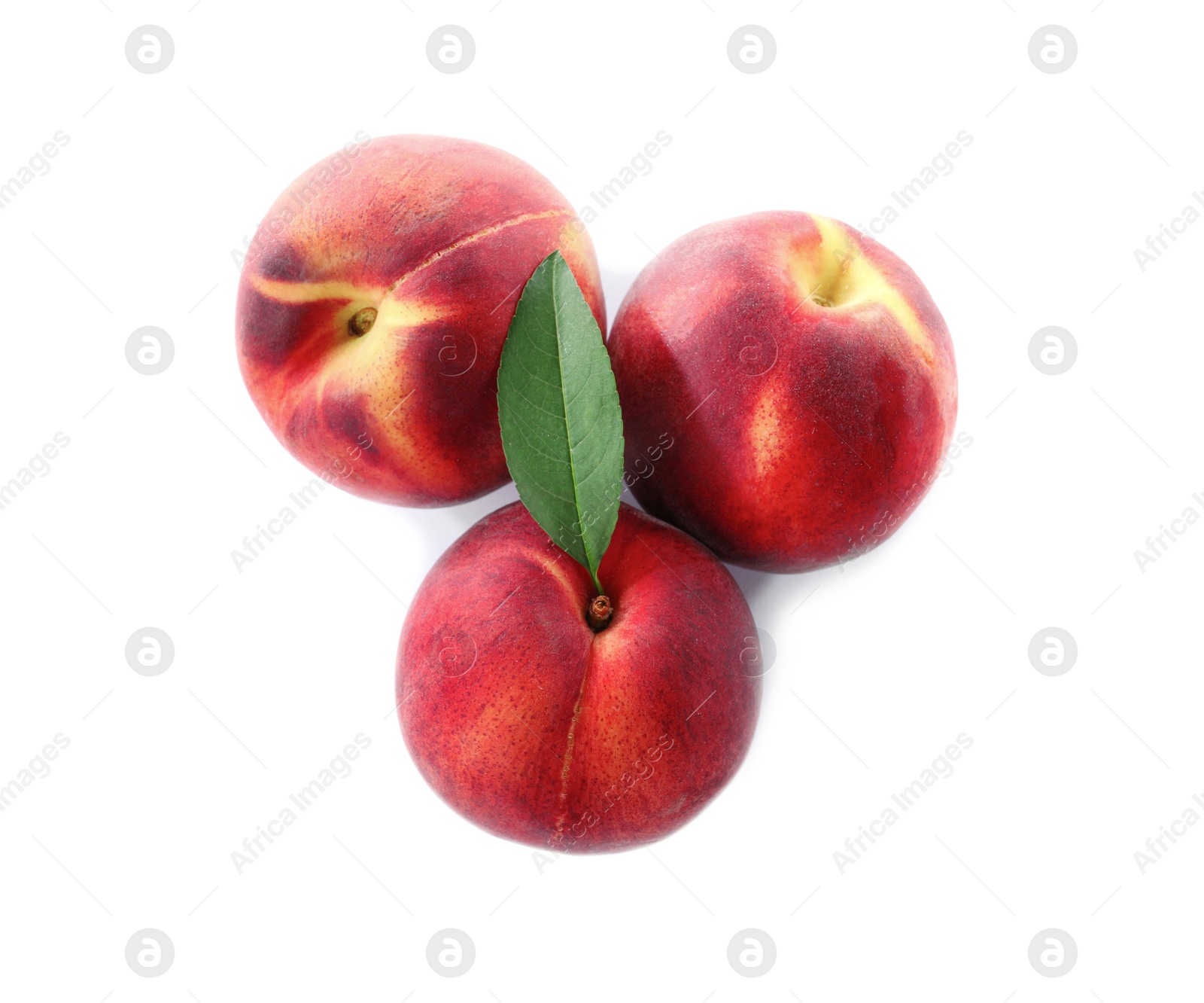 Photo of Sweet juicy peaches with leaf on white background, top view