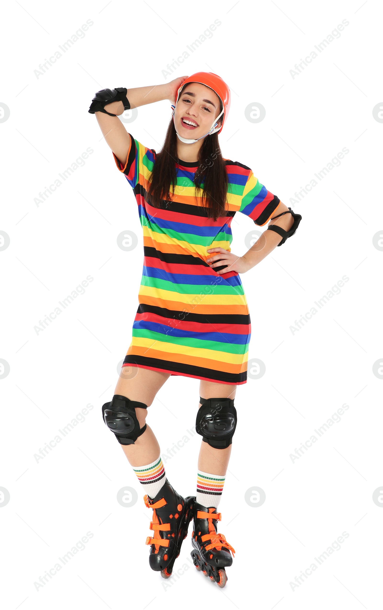 Photo of Full length portrait of young woman in bright dress with roller skates on white background