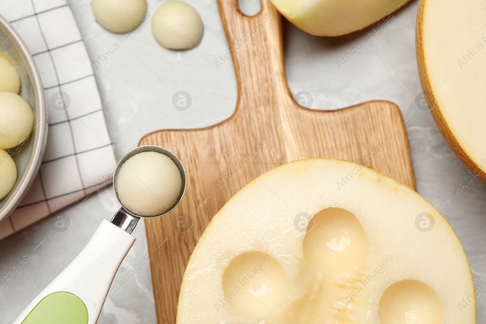 Photo of Flat lay composition with melon balls on grey table