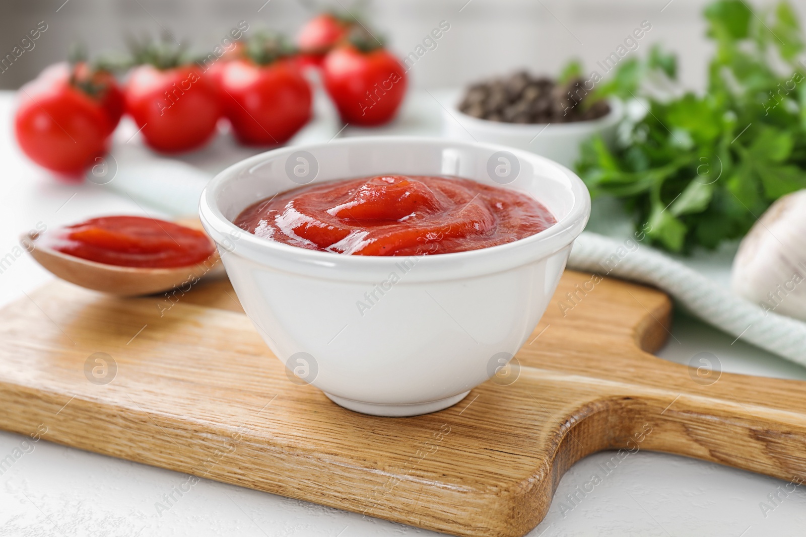 Photo of Delicious tomato sauce on white table, closeup