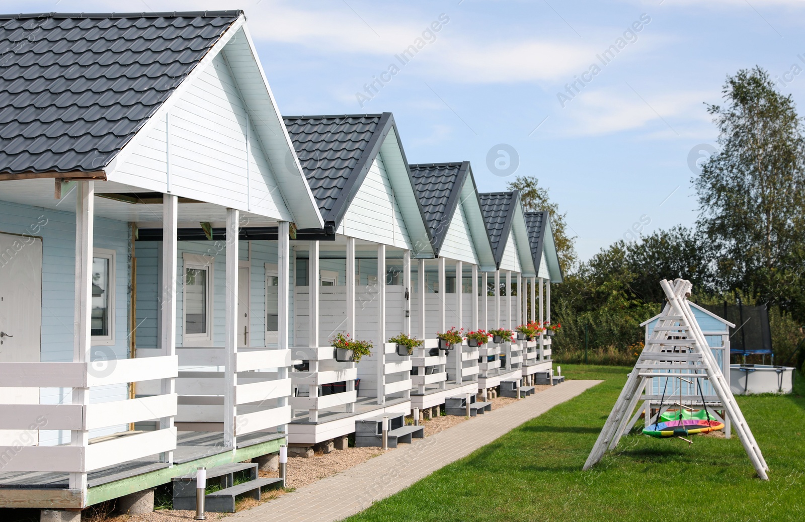 Photo of Exterior of beautiful modern white houses outdoors