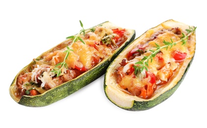 Delicious baked stuffed zucchini on white background