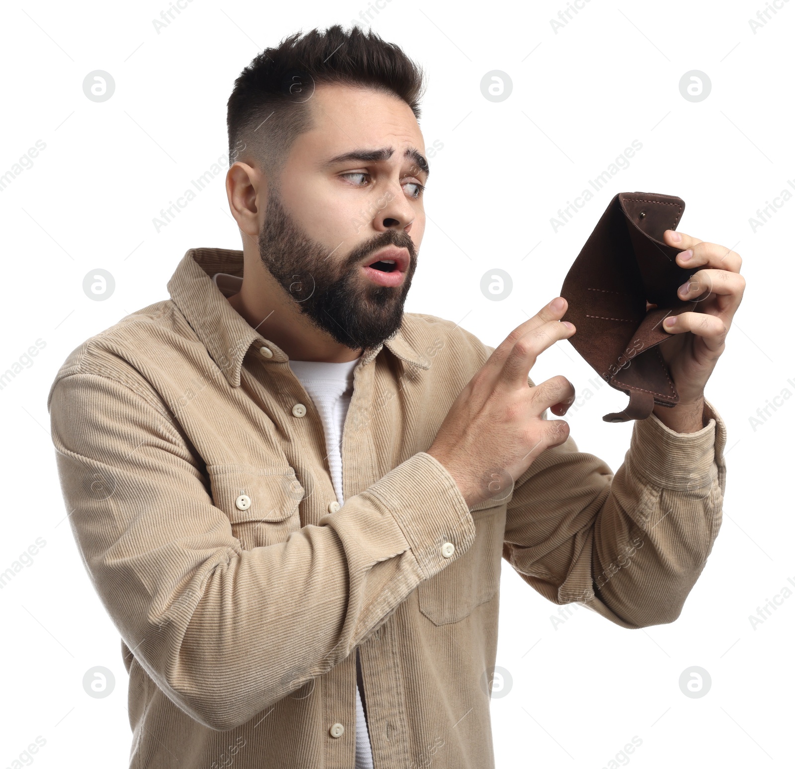 Photo of Confused man showing empty wallet on white background