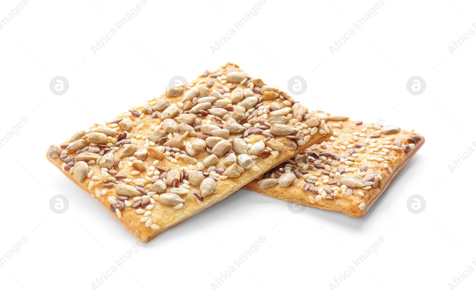 Photo of Delicious crispy crackers with different seeds isolated on white