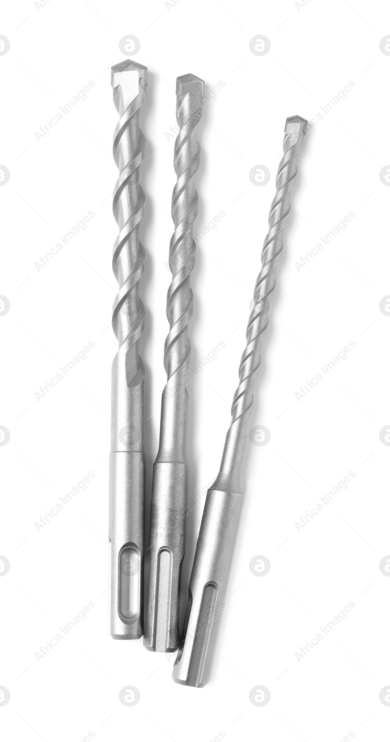 Photo of Many twist drill bits isolated on white, top view. Carpenter's tools