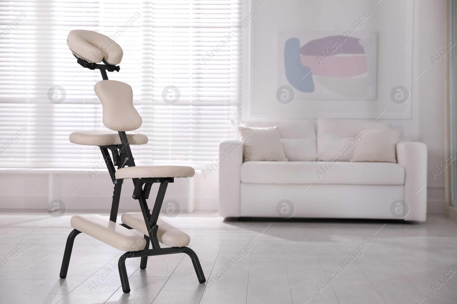 Photo of Modern massage chair in office, space for text. Medical equipment