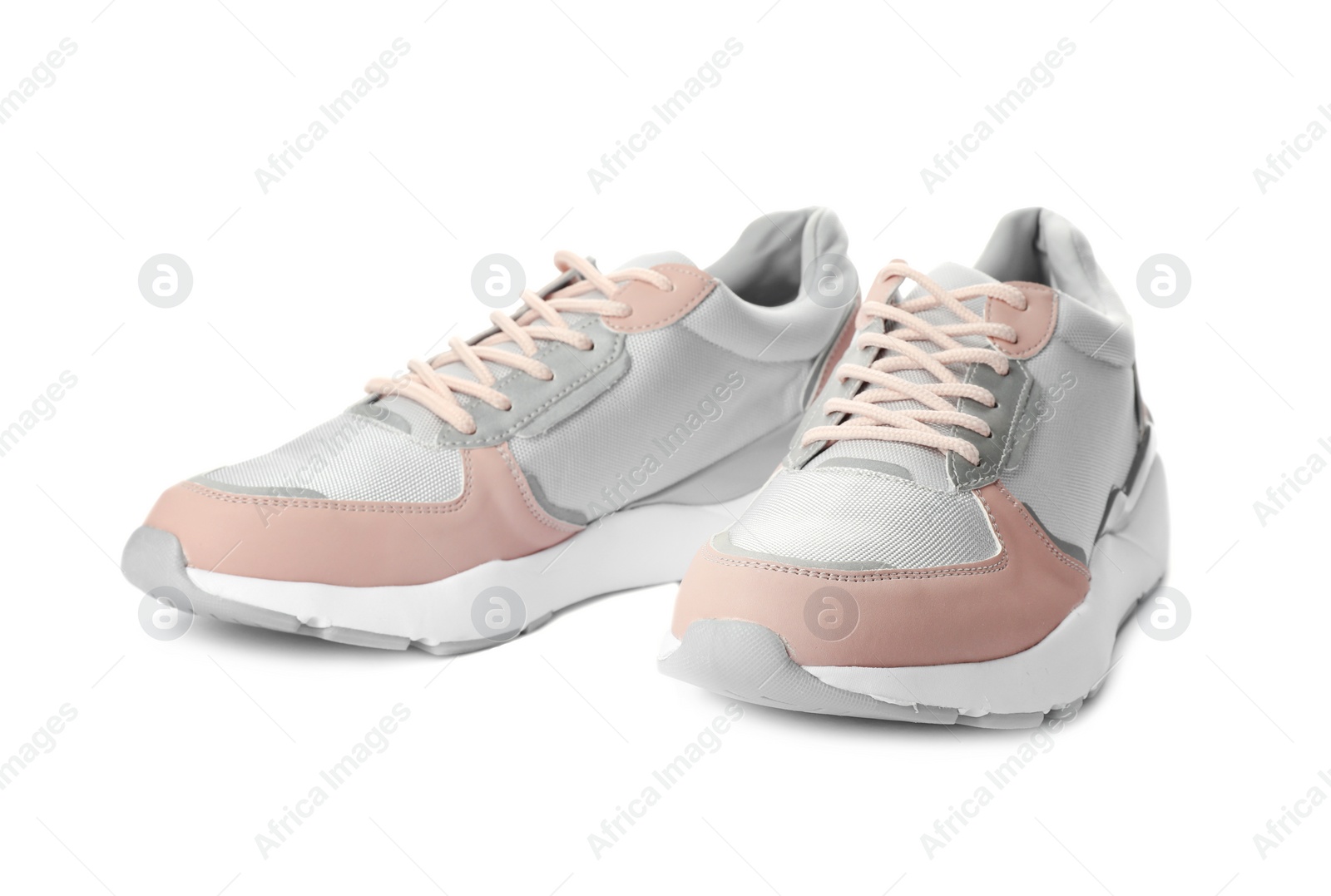 Photo of Pair of stylish sneakers on white background