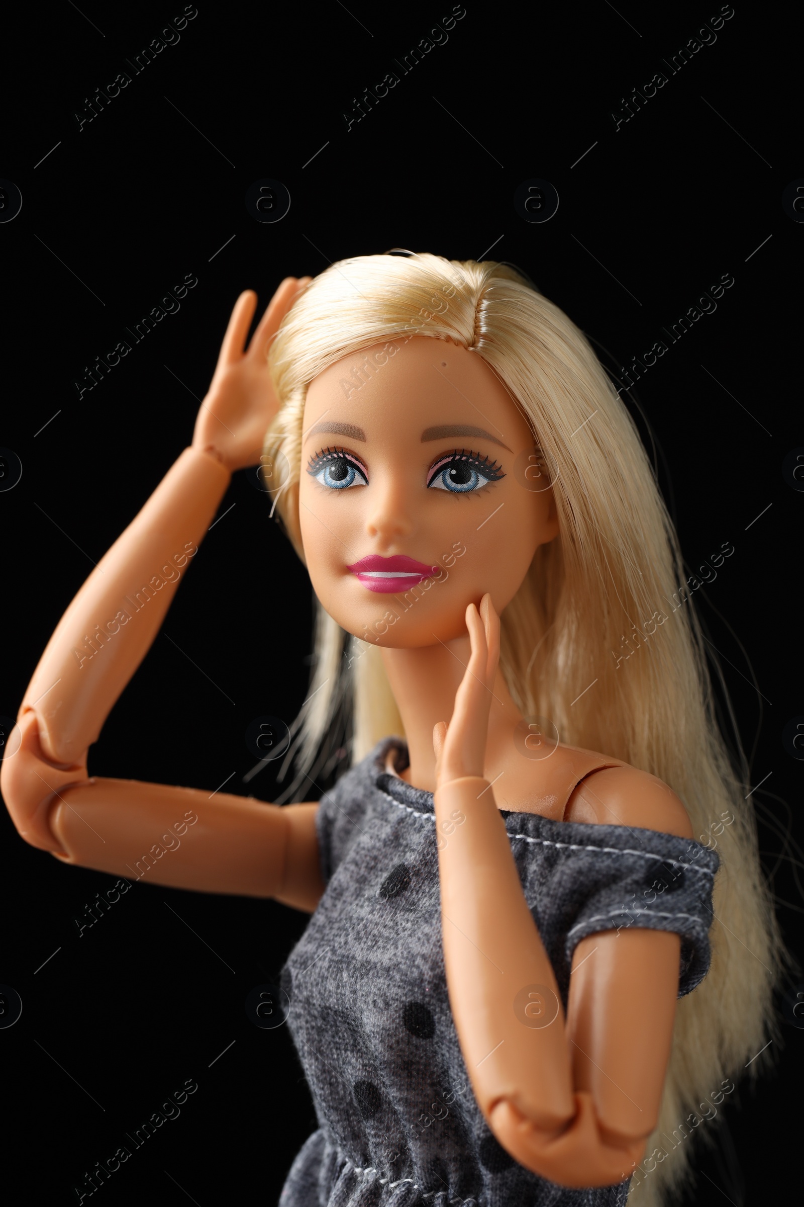 Photo of Mykolaiv, Ukraine - September 1, 2023: Beautiful Barbie doll on black background