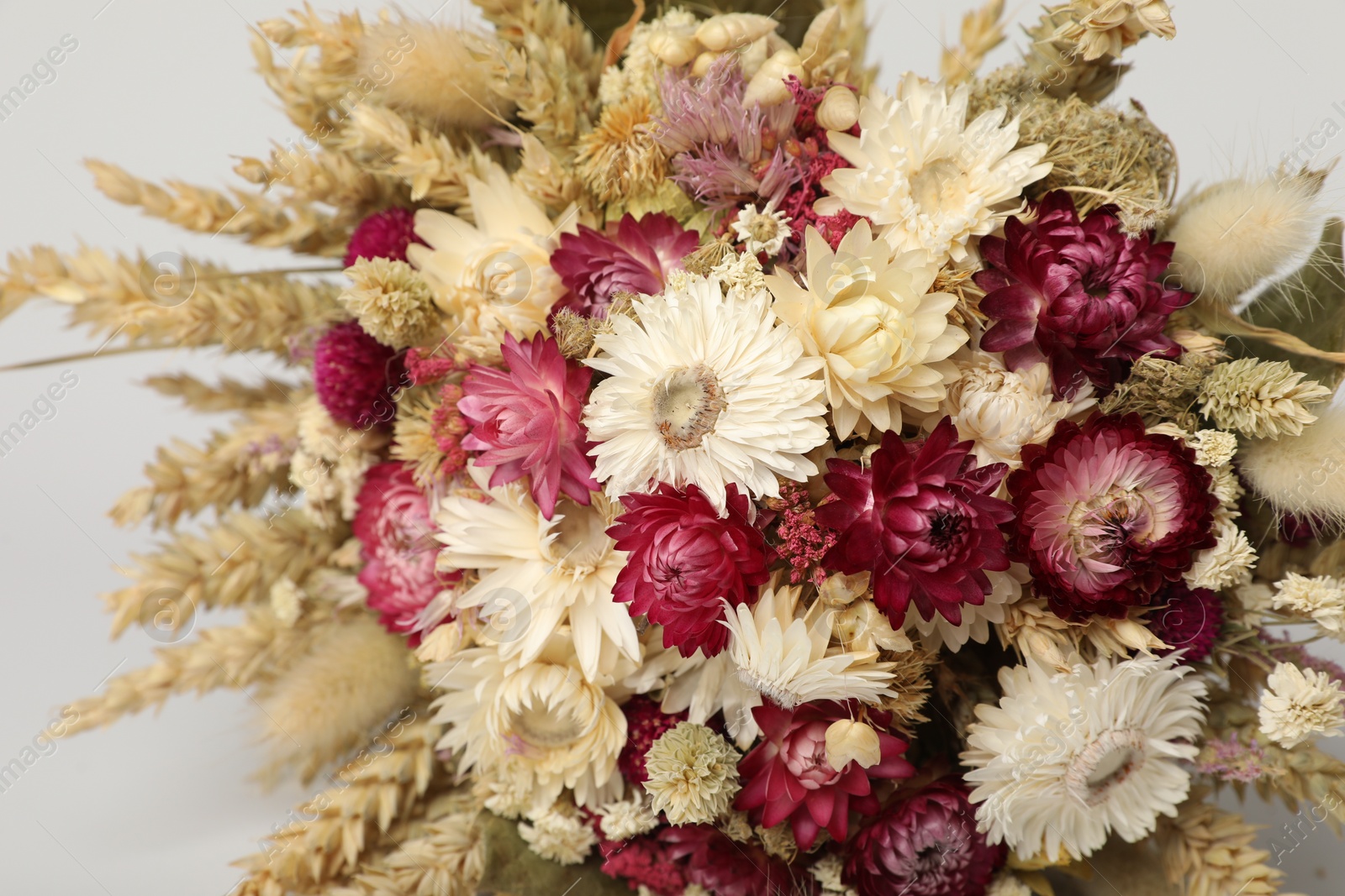 Photo of Beautiful bouquet of dry flowers on white background, closeup