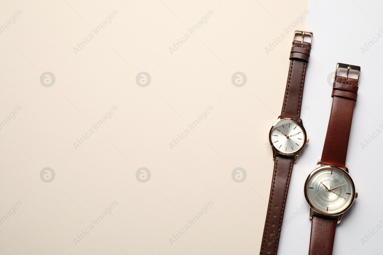 Photo of Luxury wrist watches on color background, flat lay. Space for text