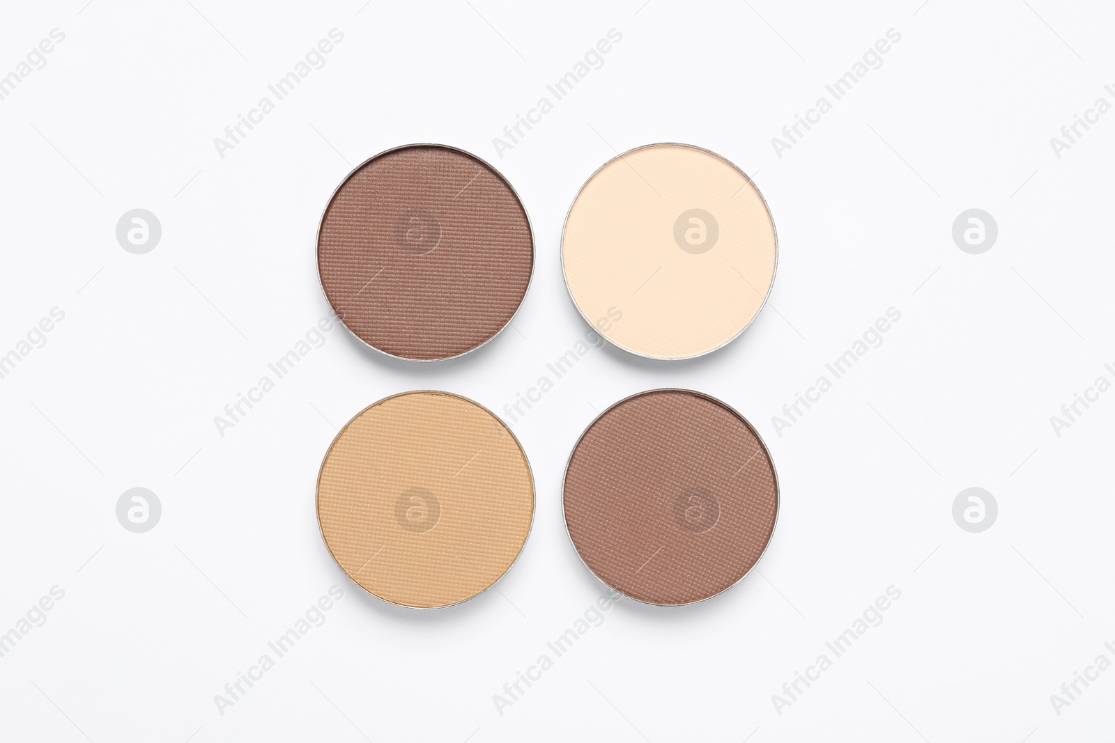 Photo of Beautiful eye shadow refill pans on white background, flat lay