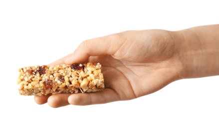 Photo of Woman holding grain cereal bar on white background. Healthy snack