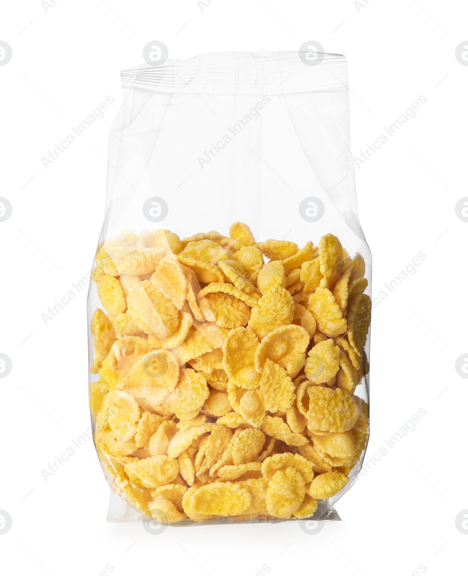 Photo of Transparent plastic pack of tasty crispy corn flakes isolated on white