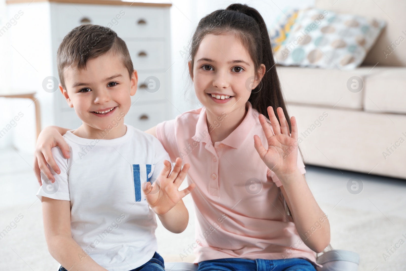 Photo of Little children using video chat at home, view from web camera